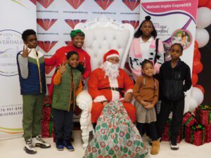 A group of children posing with santa claus.