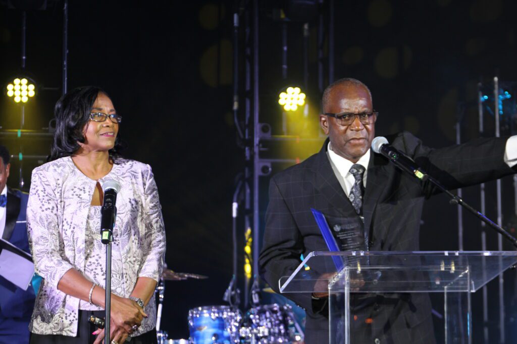 Man at podium and woman with microphone